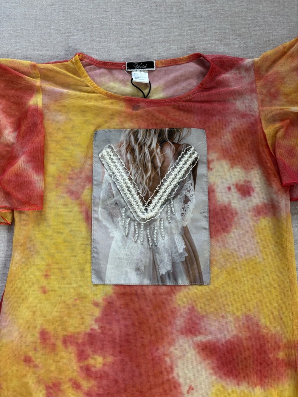 Vivid sheer tie dye beaded top.